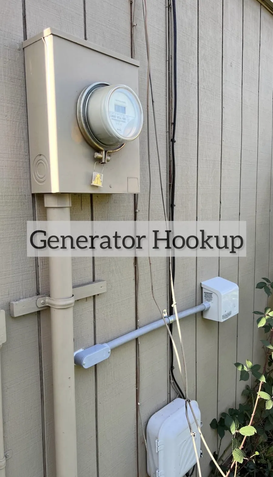 Outdoor generator inlet box and meter base with new conduit on home siding